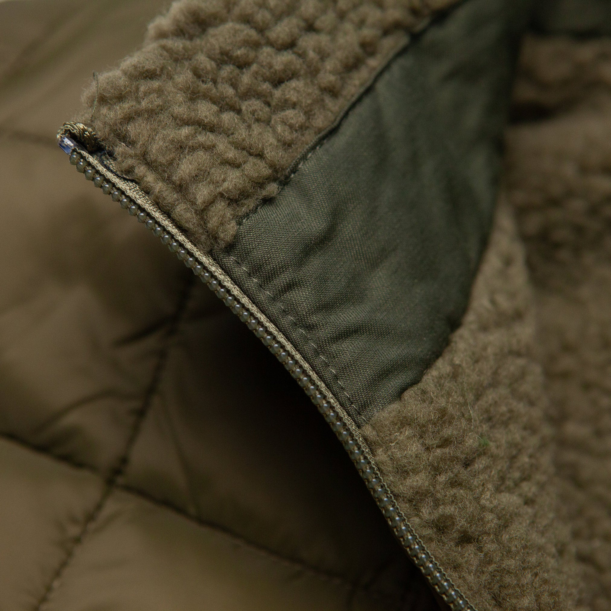 The Down Reversible Vest in Olive